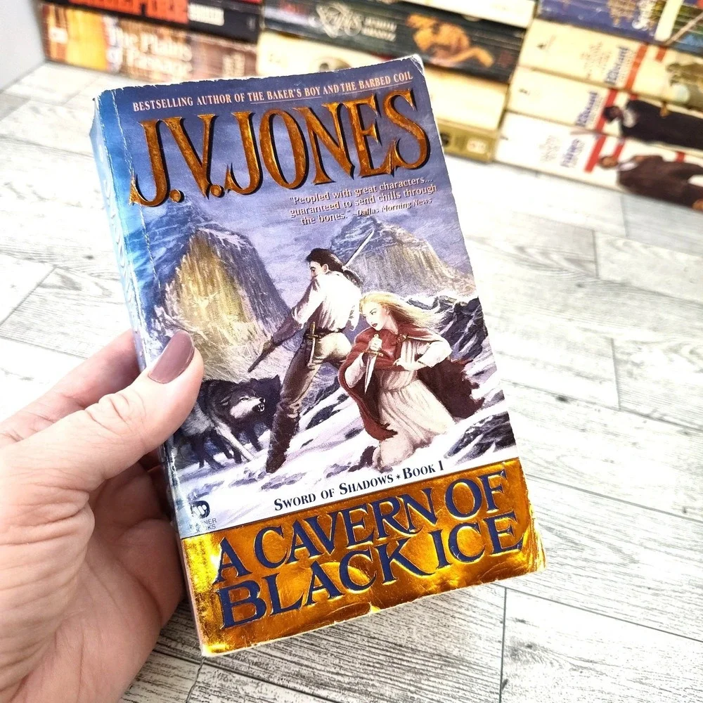 A CAVERN OF BLACK ICE JV Jones 2000 First US 11st Edition Warner Paperback‎
